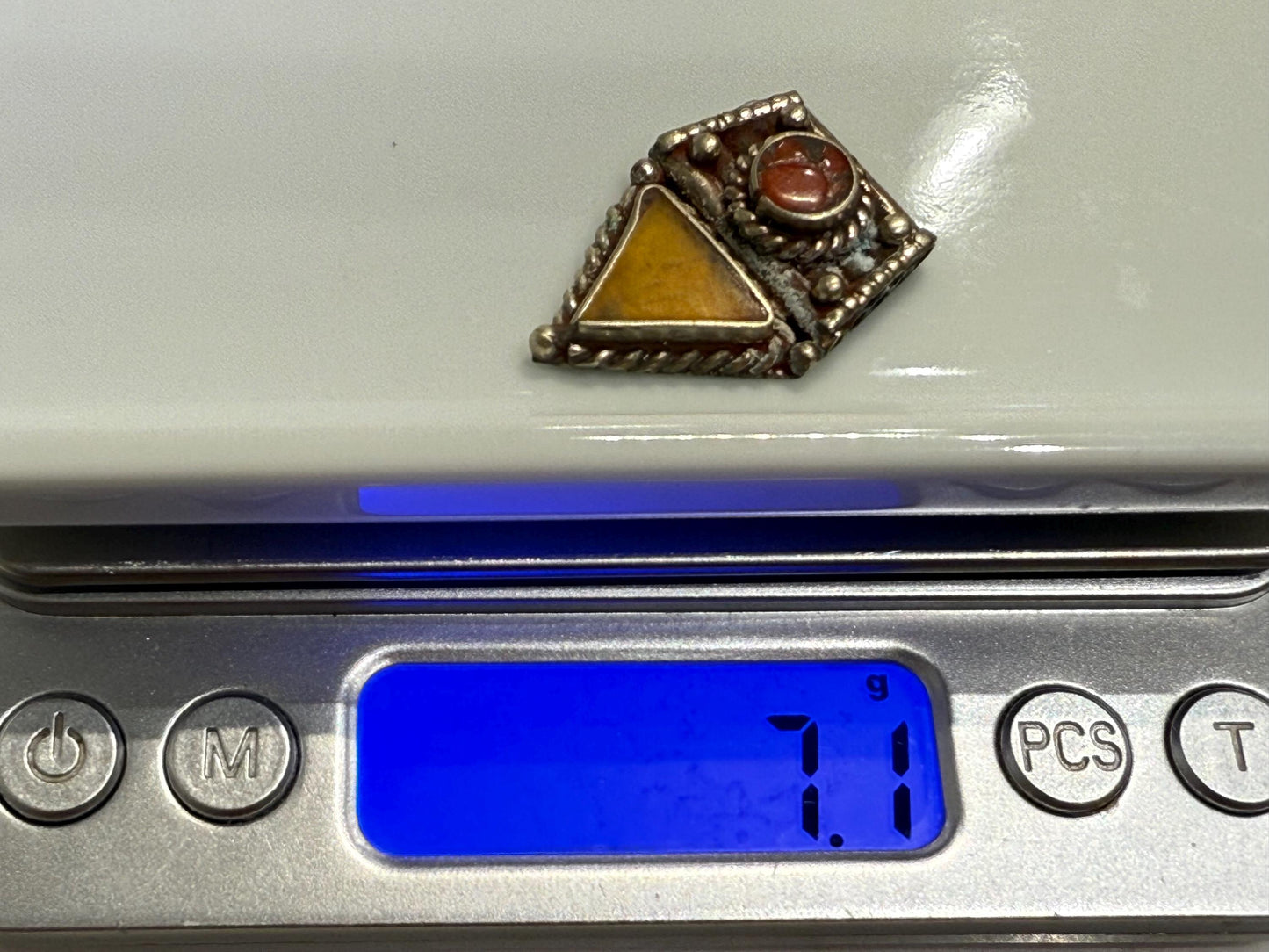 Ethnic Himalayan Pendant with Amber and Red Coral Accents | Artisan Jewelry Design