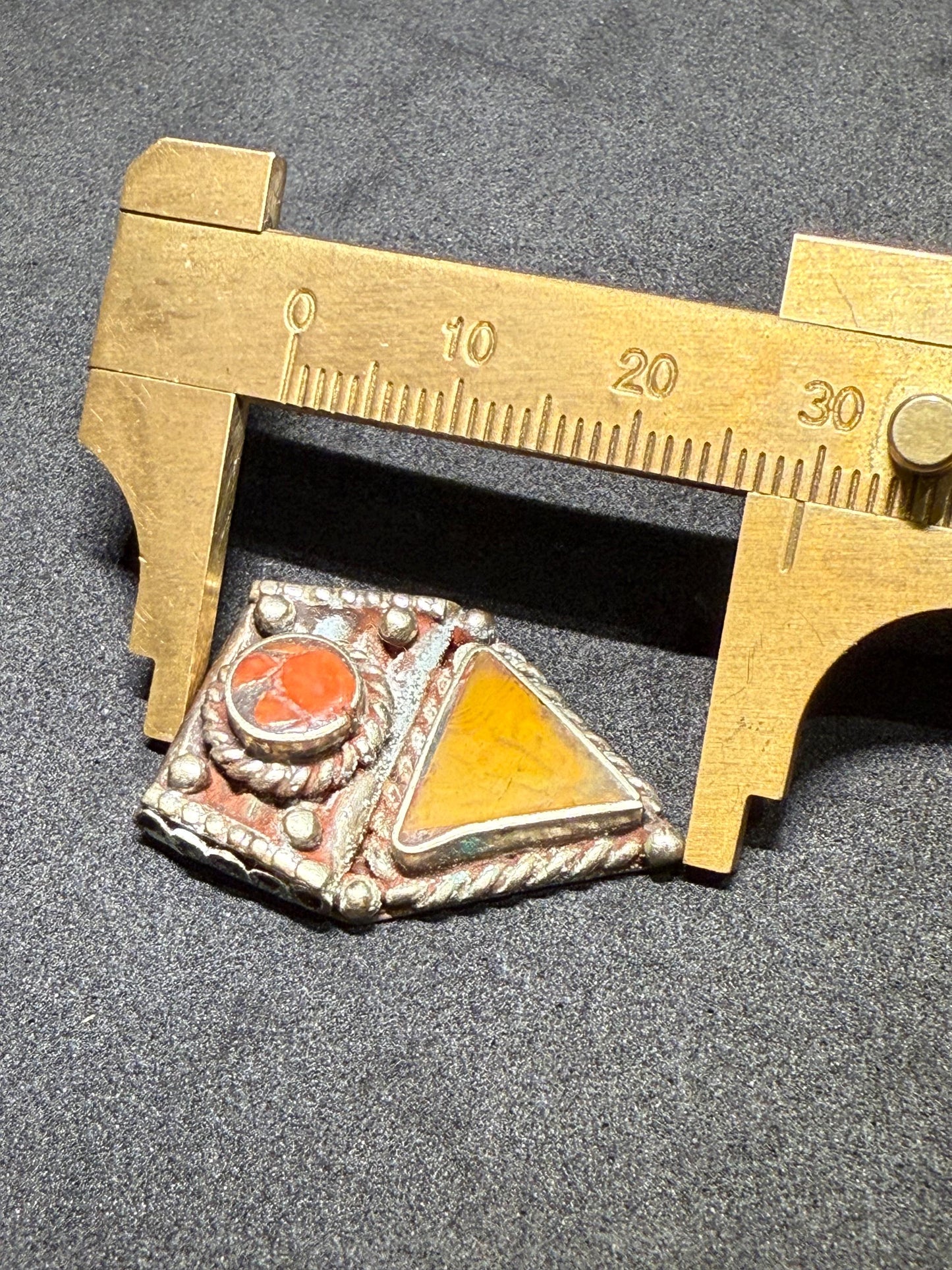 Ethnic Himalayan Pendant with Amber and Red Coral Accents | Artisan Jewelry Design