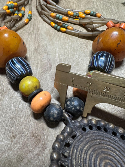 Tribal Necklace: Brass Spiral Pendant, Vintage Amber Beads, Nepalese Jewelry