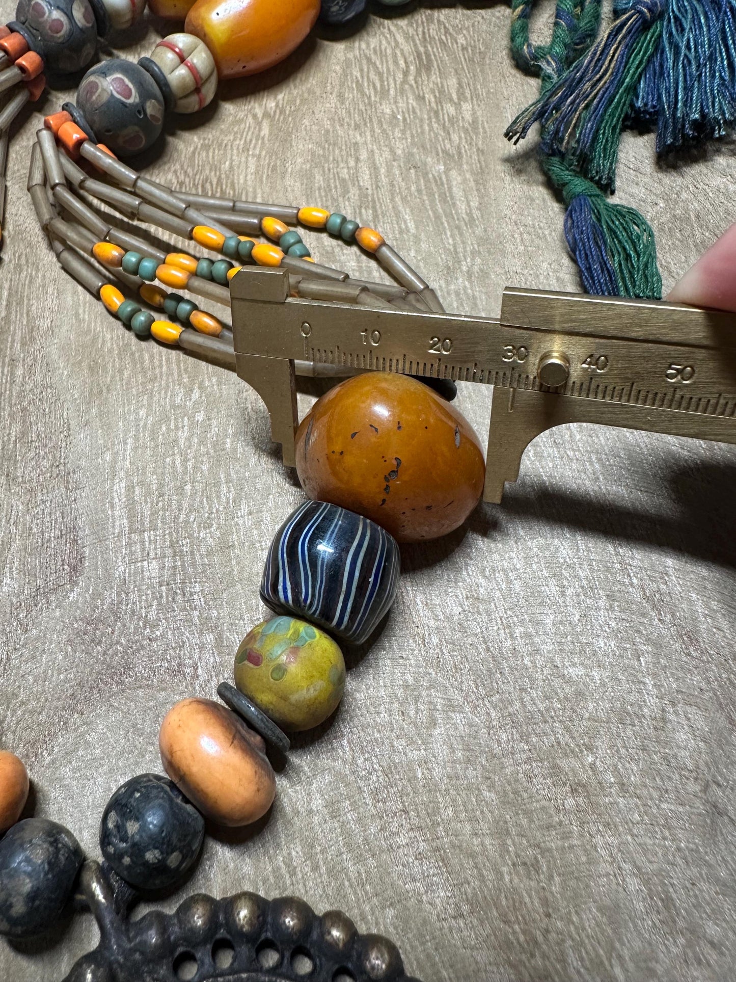 Tribal Necklace: Brass Spiral Pendant, Vintage Amber Beads, Nepalese Jewelry