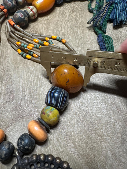 Tribal Necklace: Brass Spiral Pendant, Vintage Amber Beads, Nepalese Jewelry