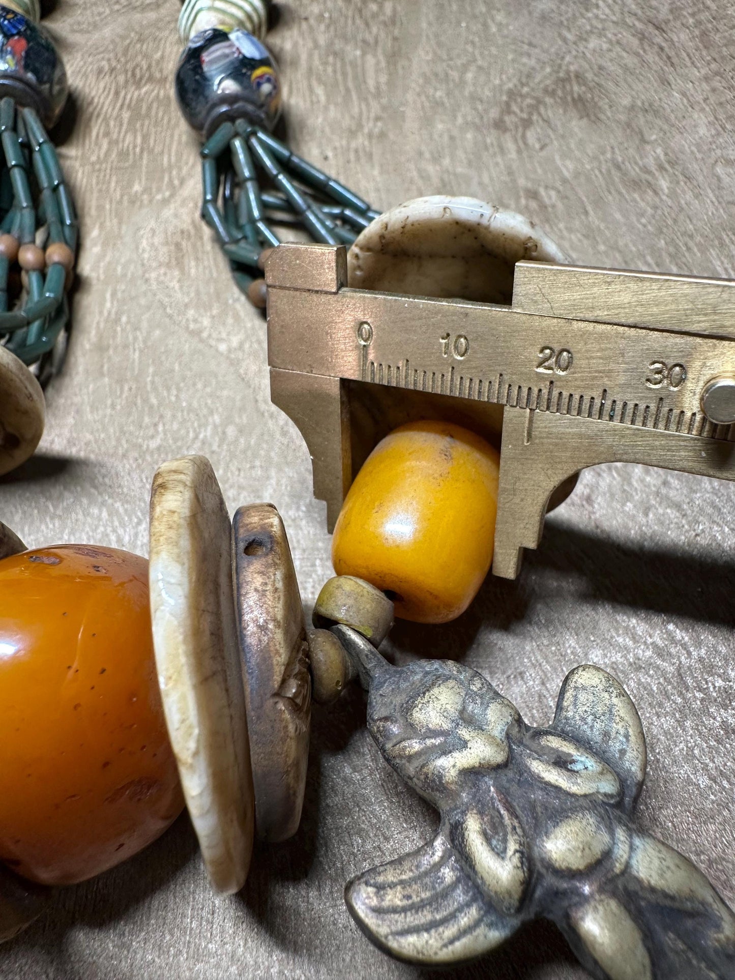 Handmade Nepal Tribal Necklace: Amber Resin, Bone & Brass Amulets