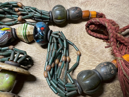 Handmade Nepal Tribal Necklace: Amber Resin, Bone & Brass Amulets