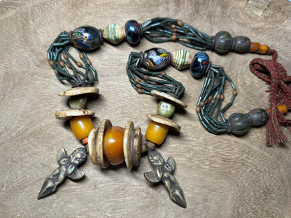 Handmade Nepal Tribal Necklace: Amber Resin, Bone & Brass Amulets
