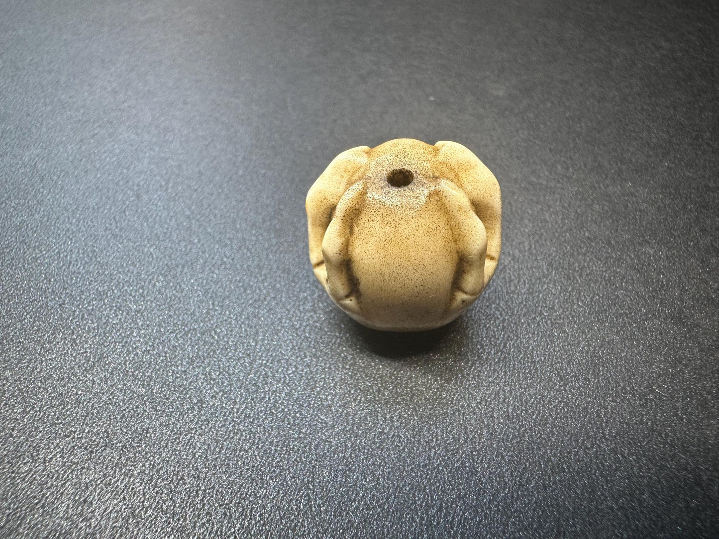 Hand-Carved Antler Citipati Skull Guru Bead with Grasping Hand  Tibetan Charnel Ground Amulet