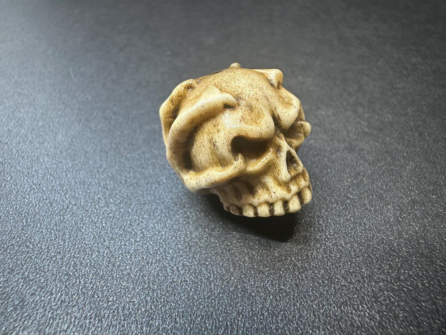 Hand-Carved Antler Citipati Skull Guru Bead with Grasping Hand  Tibetan Charnel Ground Amulet