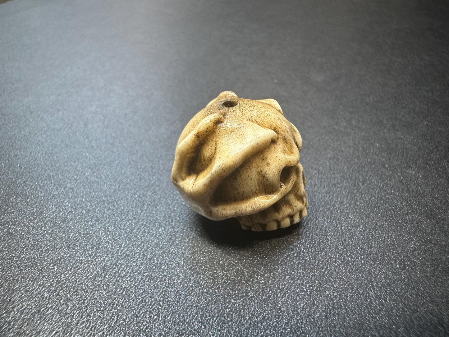 Hand-Carved Antler Citipati Skull Guru Bead with Grasping Hand  Tibetan Charnel Ground Amulet